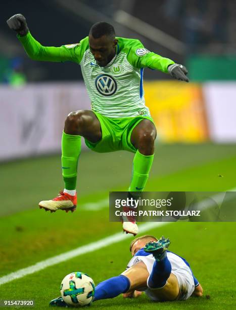 Schalke's German midfielder Max Meyer and Wolfsburg's French midfielder Josuha Guilavogui vie for the ball during the German football Cup DFB Pokal...