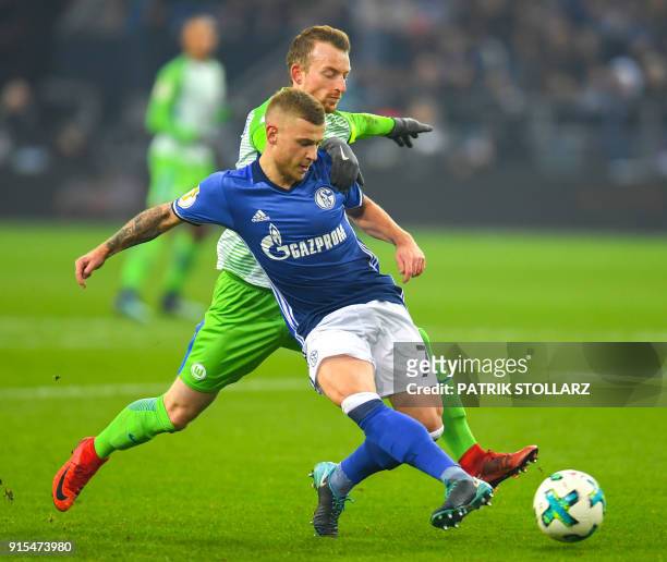 Wolfsburg's German midfielder Maximilian Arnold and Schalke's German midfielder Max Meyer vie for the ball during the German football Cup DFB Pokal...