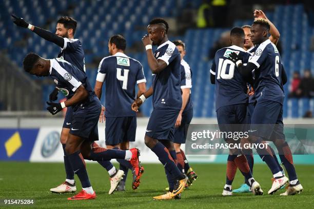 Montpellier's players react after scoring a goal during the French Cup football match between Montpellier and Lyon on February 7, 2018 at the La...