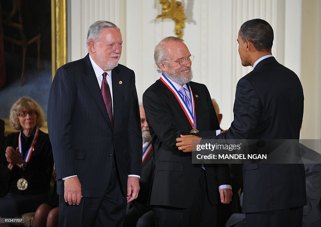 US President Barack Obama presents a Nat