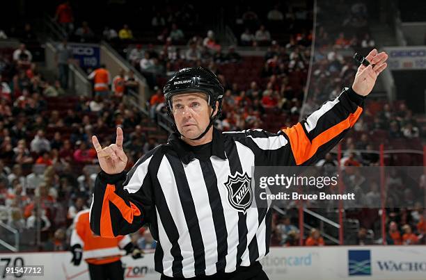 Referee Kerry Fraser looks on during a line change in the preseason NHL game between the Philadelphia Flyers and the Minnesota Wild at the Wachovia...