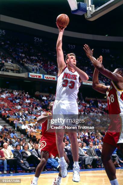Dwayne Schintzius of the New Jersey Nets shoots during a game played on April 19, 1995 at Continetal Airlines Arena in East Rutherford, New Jersey....