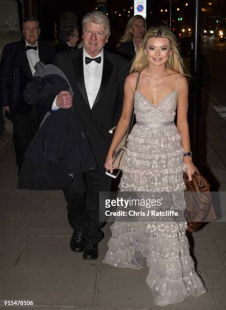 Stanley Johnson, father of Boris Johnson, and Georgia Toffolo, reality TV star, arrive for the Conservative party Black and White Ball at Natural...