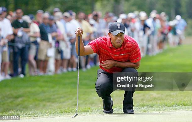 Tiger Woods lines up a putt during the final round of the Deutsche Bank Championship held at TPC Boston on September 7, 2009 in Norton, Massachusetts.