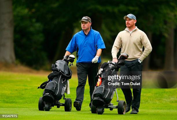 Adrian Ambler and Aaron Wainwright walk down the course during the SkyCaddie PGA Fourball Championship at Forest Pines Golf Club on October 07, 2009...