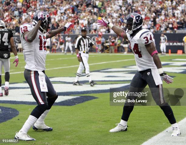 Houston Texan Jacoby Jones of the Houston Texans receives congratulations from teammate Dominique Barber after his 95 yard kick return at Reliant...