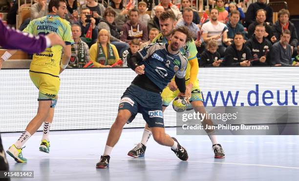 Raphael Caucheteux of Saint-Raphael VHB, Fabian Wiede of Fuechse Berlin and Alexander Lynggaard of Saint-Raphael VHB during the EHF-Cup game between...