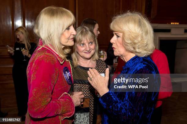 Camilla, Duchess of Cornwall meets Lynn Faulds Wood during a reception for Women in Journalism at The Ned on February 7, 2018 in London, England.