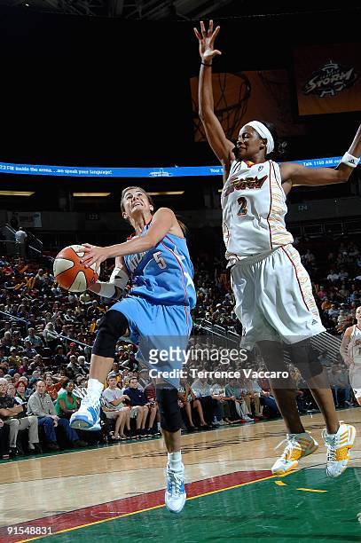 Shalee Lehning of the Atlanta Dream goes to the basket against Swin Cash of the Seattle Storm during the WNBA game on August 29, 2009 at the Key...