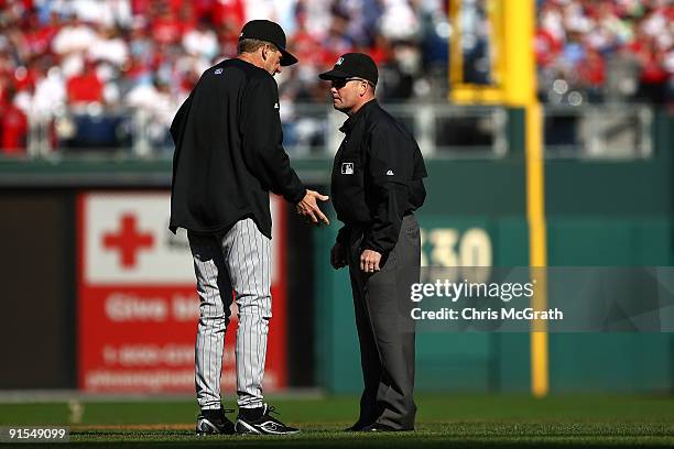 Manager Jim Tracy of the Colorado Rockies argues with second base umpire Jerry Meals after he felt Cliff Lee of the Philadelphia Phillies should of...