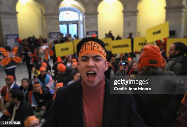 Immigration activists conduct an act of civil disobediance in the rotunda of the Russell Senate Office Building on February 7, 2018 in Washington...