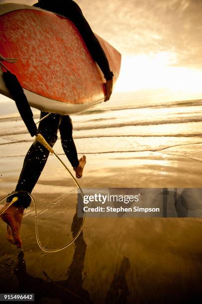 girl runs with surfboard at california beach - la jolla stock pictures, royalty-free photos & images