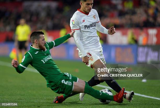 Sevilla's Argentinian midfielder Joaquin Correa vies for the ball with Leganes's defender Tito during the Spanish 'Copa del Rey' second leg...