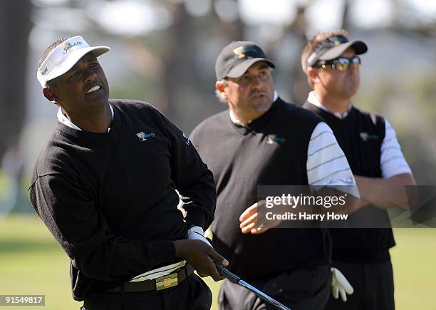 Vijay Singh, Angel Cabrera and Robert Allenby of the International Team watch a shot during a practice round prior to the start of The Presidents Cup...