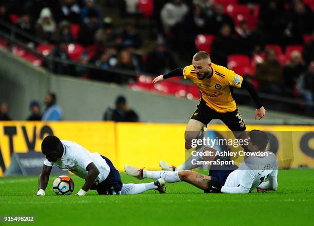 Newport County's Dan Butler battles with Tottenham Hotspur's Moussa Sissoko and Erik Lamela during the The Emirates FA Cup Fourth Round Replay match...
