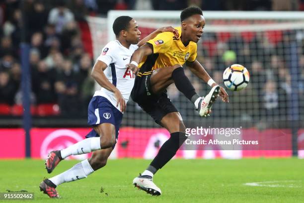 Shawn McCoulsky of Newport County is challenged by Kyle Walker-Peters of Tottenham Hotspur during the Fly Emirates FA Cup Fourth Round Replay match...