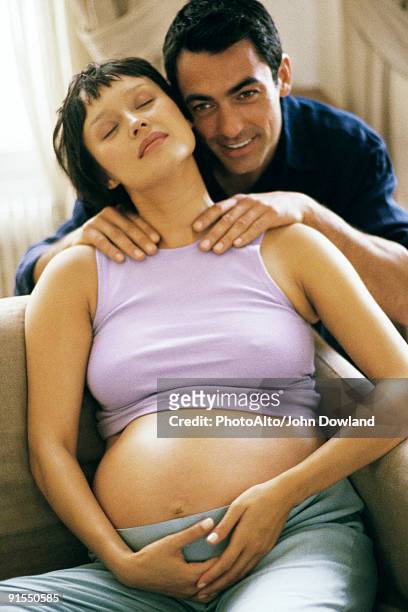 man massaging pregnant wife's shoulders - girlfriend massage stock pictures, royalty-free photos & images