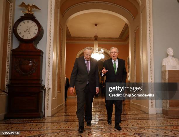 Senate Minority Leader Charles Schumer and Senate Majority Leader Mitch McConnell walk side-by-side to the Senate Chamber at the U.S. Capitol...