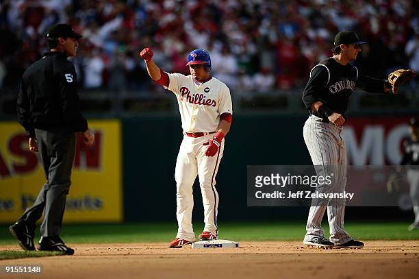 Carlos Ruiz of the Philadelphia Phillies celebrates after he advanced to second on his RBI single to score Raul Ibanez in the bottom of the fifth...