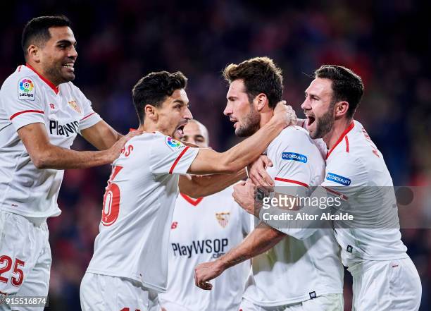 Franco Vazquez of Sevilla FC celebrates with his teammates Gabriel Mercado and Miguel Layun and Jesus Navas of Sevilla FC after scoring his team's...