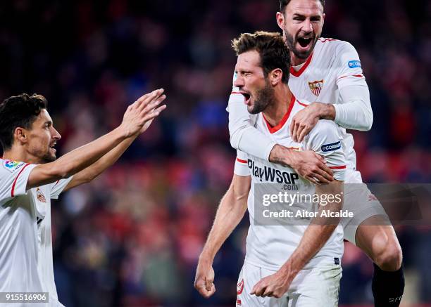 Franco Vazquez of Sevilla FC celebrates with his teammates Miguel Layun and Jesus Navas of Sevilla FC after scoring his team's second goal during the...