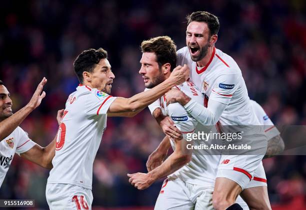 Franco Vazquez of Sevilla FC celebrates with his teammates Miguel Layun and Jesus Navas of Sevilla FC after scoring his team's second goal during the...