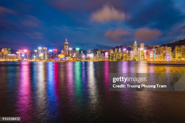 view of tsim sha tsui, kowloon, hong kong with the clock tower - kowloon east stock pictures, royalty-free photos & images