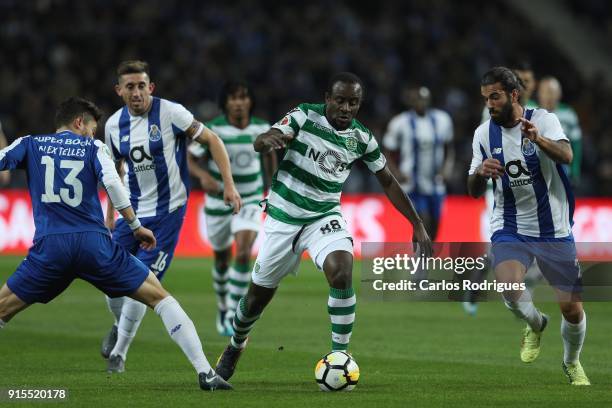 Sporting CP forward Seydou Doumbia from Ivory Coast tries to escape FC Porto defender Alex Telles from Brazil and FC Porto midfielder Sergio Oliveira...