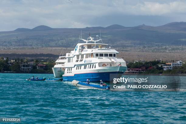 Tourism yatch remains docked at Puerto Ayora bay, in Santa Cruz Island, Galapagos, Ecuador, on January 20, 2018. - Ecuador's growing tourism...