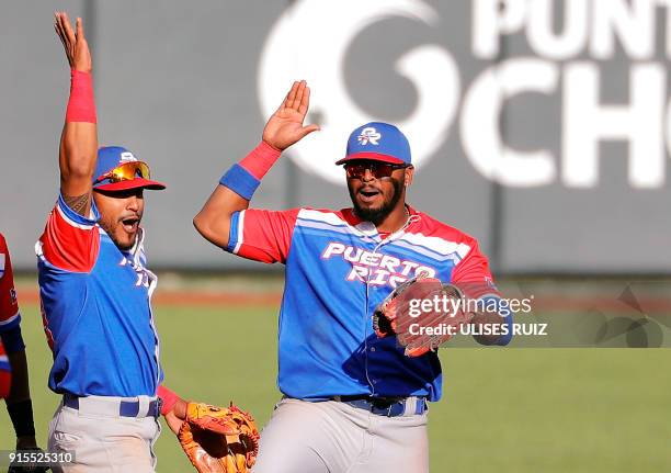 Jesmuel Valentin of Criollos de Caguas of Puerto Rico celebrates with teammate Anthony Garcia after scoring against Caribes de Anzoategui of...