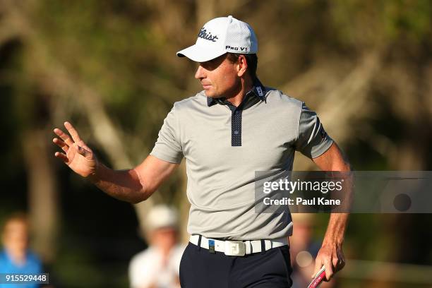 Brett Rumford of Australia acknowledges the gallery after outting on the 10th green during day one of the World Super 6 at Lake Karrinyup Country...