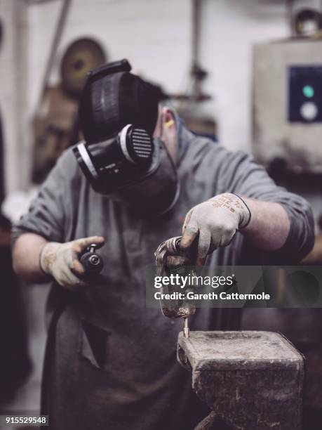 Fetler Anthony Phillips works during the BAFTA masks casting at New Pro Foundries Ltd on February 7, 2018 in London, England. The EE British Academy...