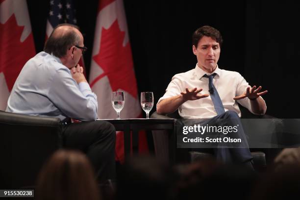 Canada Prime Minister Justin Trudeau speaks with David Axelrod, former advisor to President Obama, during an event sponsored by the University of...