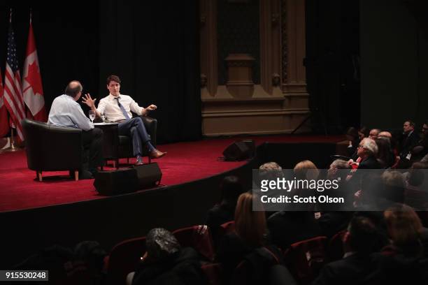 Canada Prime Minister Justin Trudeau speaks with David Axelrod, former advisor to President Obama, during an event sponsored by the University of...