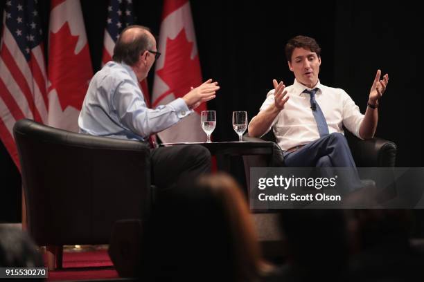 Canada Prime Minister Justin Trudeau speaks with David Axelrod, former advisor to President Obama, during an event sponsored by the University of...