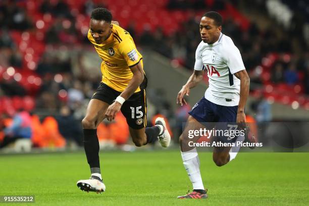 Shawn McCoulsky of Newport County is chased by Kyle Walker-Peters of Tottenham Hotspur during the Fly Emirates FA Cup Fourth Round Replay match...