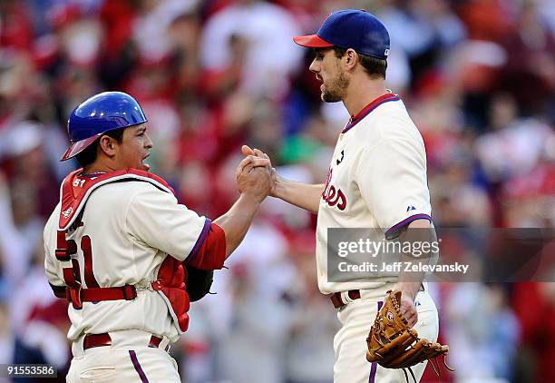 Catcher Carlos Ruiz and Cliff Lee of the Philadelphia Phillies celebrate their 5-1 win against the Colorado Rockies in Game One of the NLDS during...