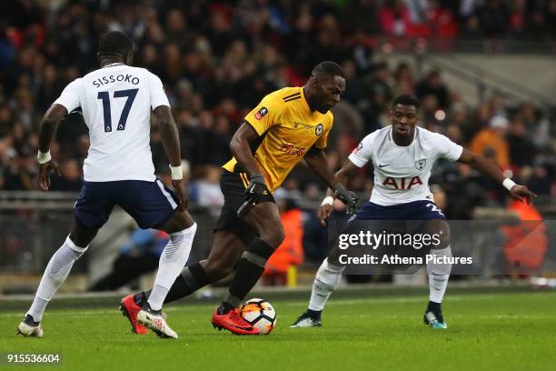 Frank Nouble of Newport County is marked by Moussa Sissoko of Tottenham Hotspur during the Fly Emirates FA Cup Fourth Round Replay match between...