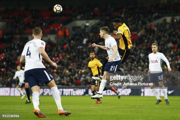 Juan Foyth of Tottenham Hotspur and Shawn McCoulsky of Newport County contend for the aerial ball during the Fly Emirates FA Cup Fourth Round Replay...