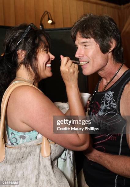 Actors Devin Devasquez and Ronn Moss pose in the Daytime Emmy official gift lounge produced by On 3 Productions held at The Orpheum Theatre on August...