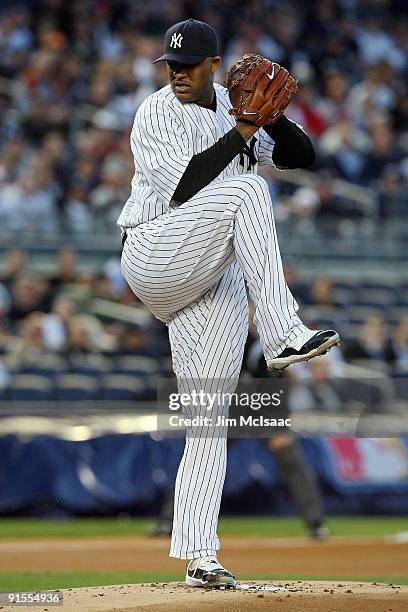 Starting pitcher CC Sabathia of the New York Yankees deals against the Minnesota Twins in Game One of the ALDS during the 2009 MLB Playoffs at Yankee...