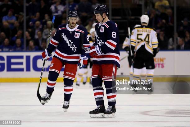 Paul Carey and Cody McLeod of the New York Rangers react after a goal by Tim Schaller of the Boston Bruins to put the Bruins up 4-1 in the second...