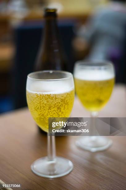 close up shot with foam beer of german dark beer inside beer mug - ale stock pictures, royalty-free photos & images