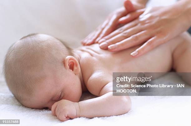 baby boy (2-5 months) receiving hand massage - massage boy bildbanksfoton och bilder
