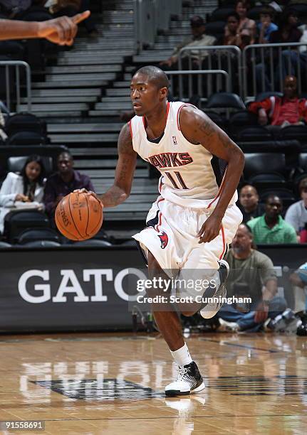 Jamal Crawford of the Atlanta Hawks advances the ball against the New Orleans Hornets during a preseason game on October 7, 2009 at Philips Arena in...