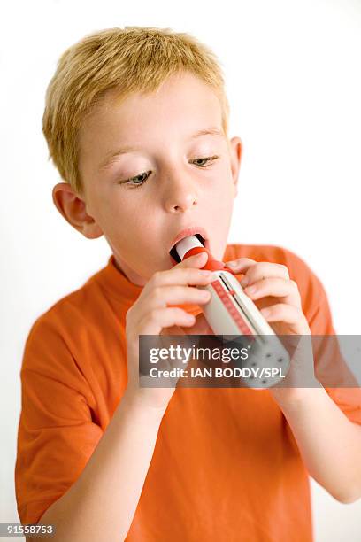 boy breathing into pyrometer, tool for measuring lung function - spirometer stock pictures, royalty-free photos & images