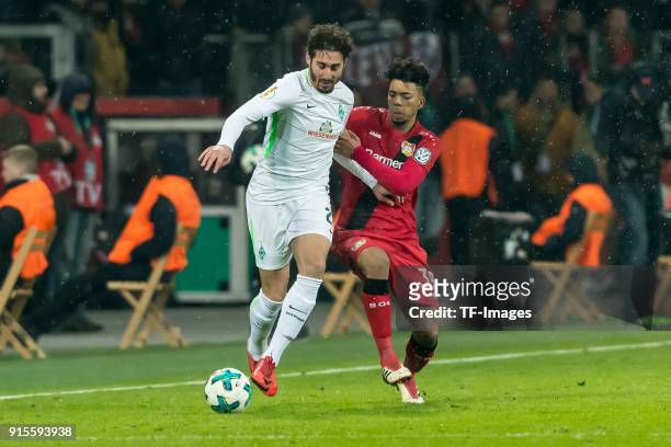 Ishak Belfodil of Bremen and Boubacar Barry of Bremen battle for the ball during the DFB Cup match between Bayer Leverkusen and Werder Bremen at...
