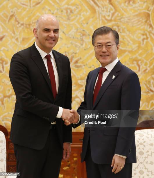 Swiss Federal President Alain Berset shakes hands with South Korean President Moon Jae-in prior their meeting at the presidential office Cheong Wa...