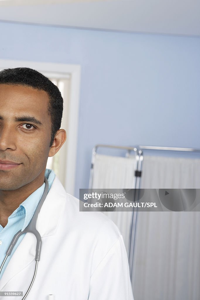 Male doctor with stethoscope, portrait