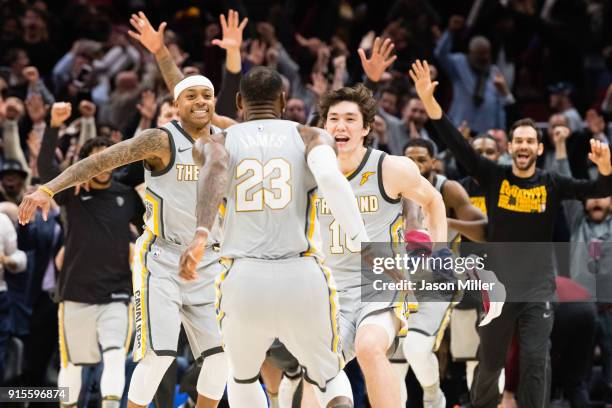 Isaiah Thomas and Cedi Osman celebrate with LeBron James of the Cleveland Cavaliers after James scored the game winning point during last second of...